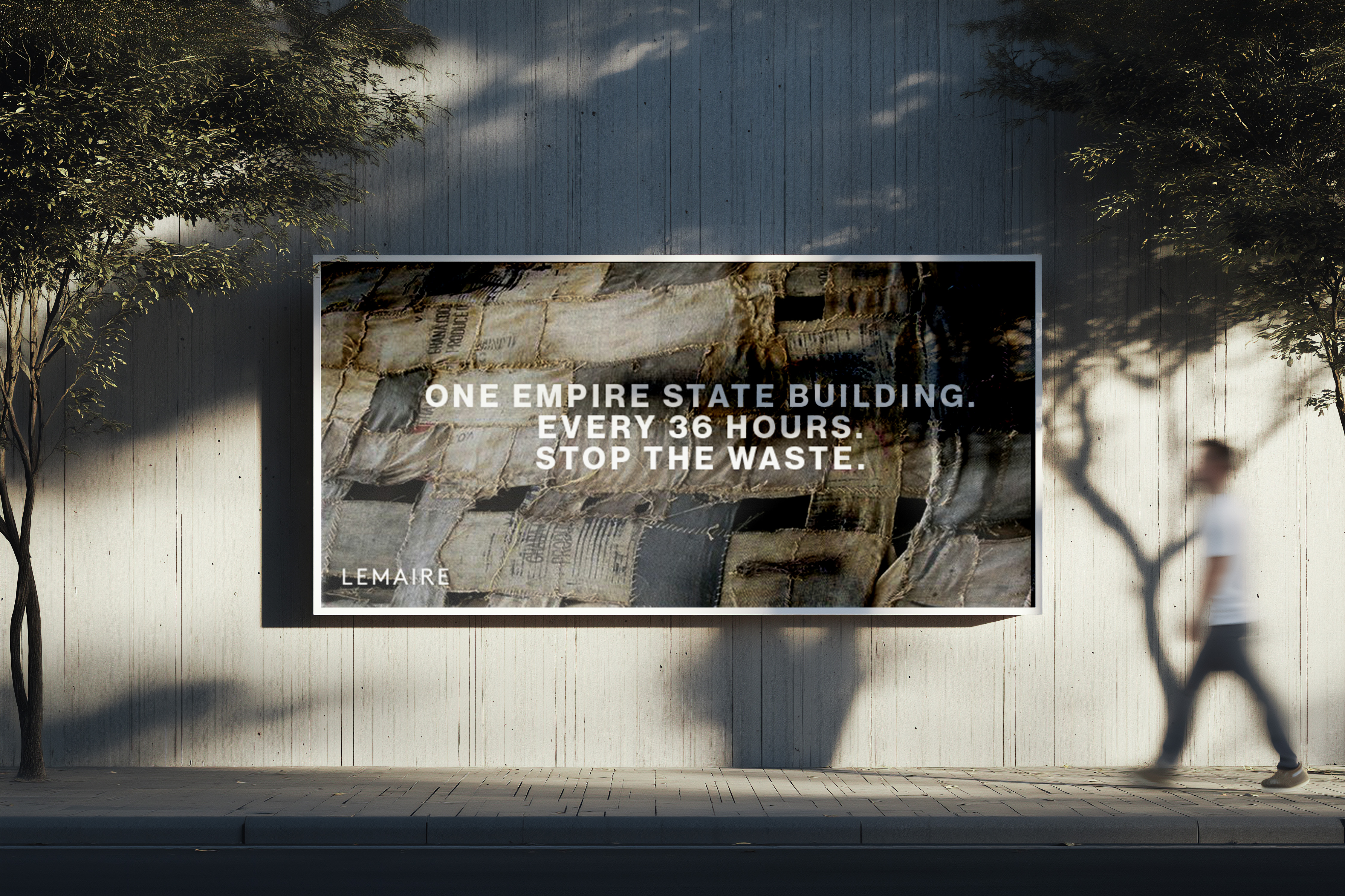 Street-level billboard mockup for Lemaire's 92-million-ton textile waste sustainability campaign